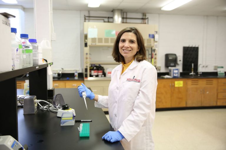 Woman in lab coat